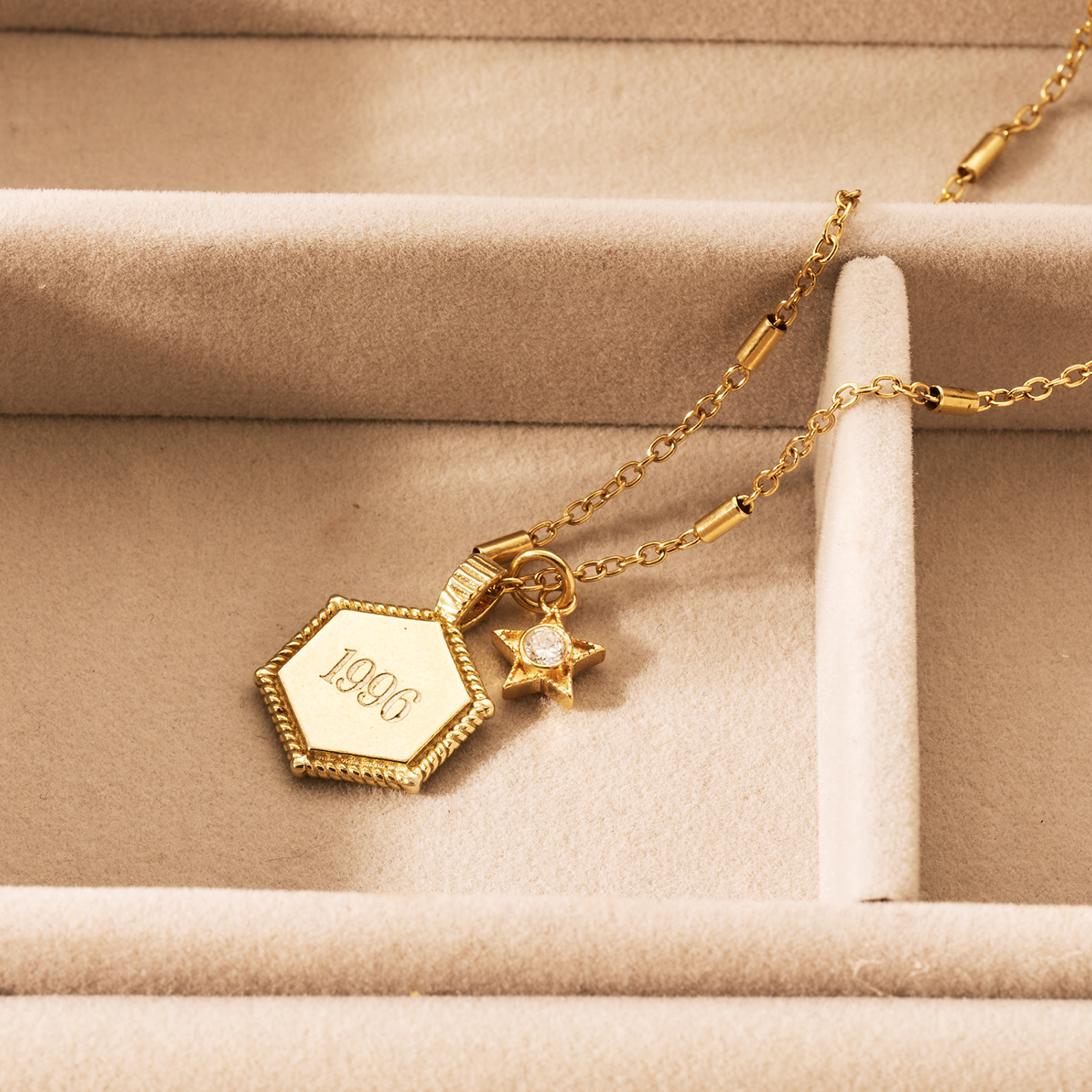 Gold necklace engraved with date of birth